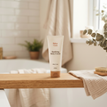 Soothing Baby Cream 200ml tube with cork base on wooden bath tray